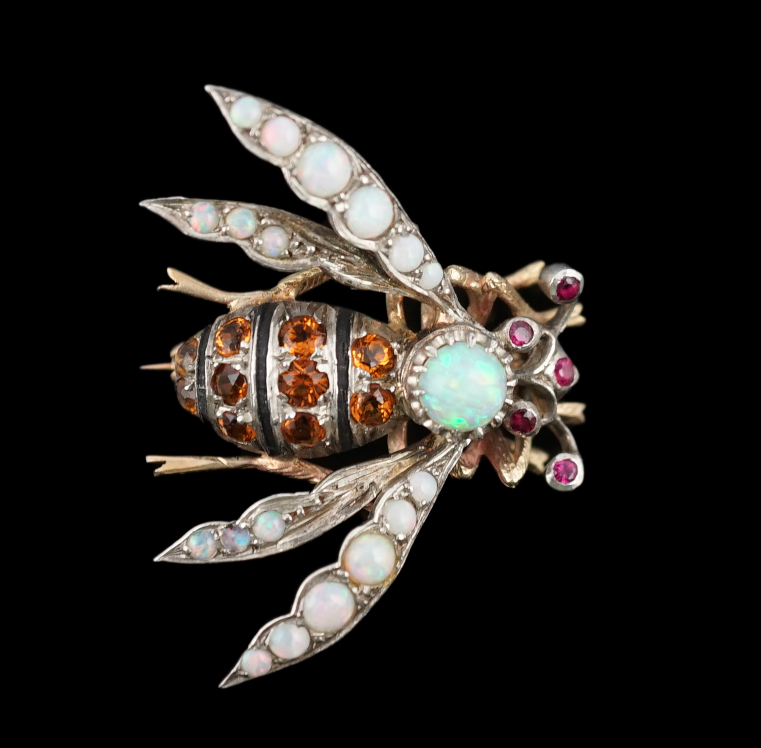 A late Victorian gold and silver, white opal, ruby and citrine? cluster set bug brooch